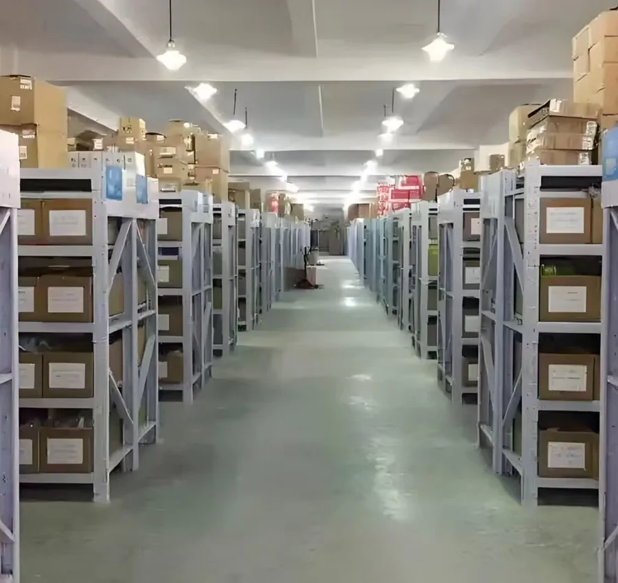 Long warehouse aisle with numbered racks holding labelled parcels