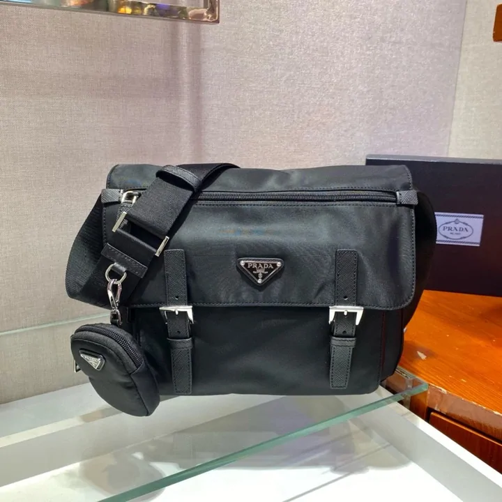Black nylon messenger bag product photo of the kind a catalogue card shows