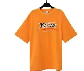 Orange graphic tee with a retro script print, shot on a hanger